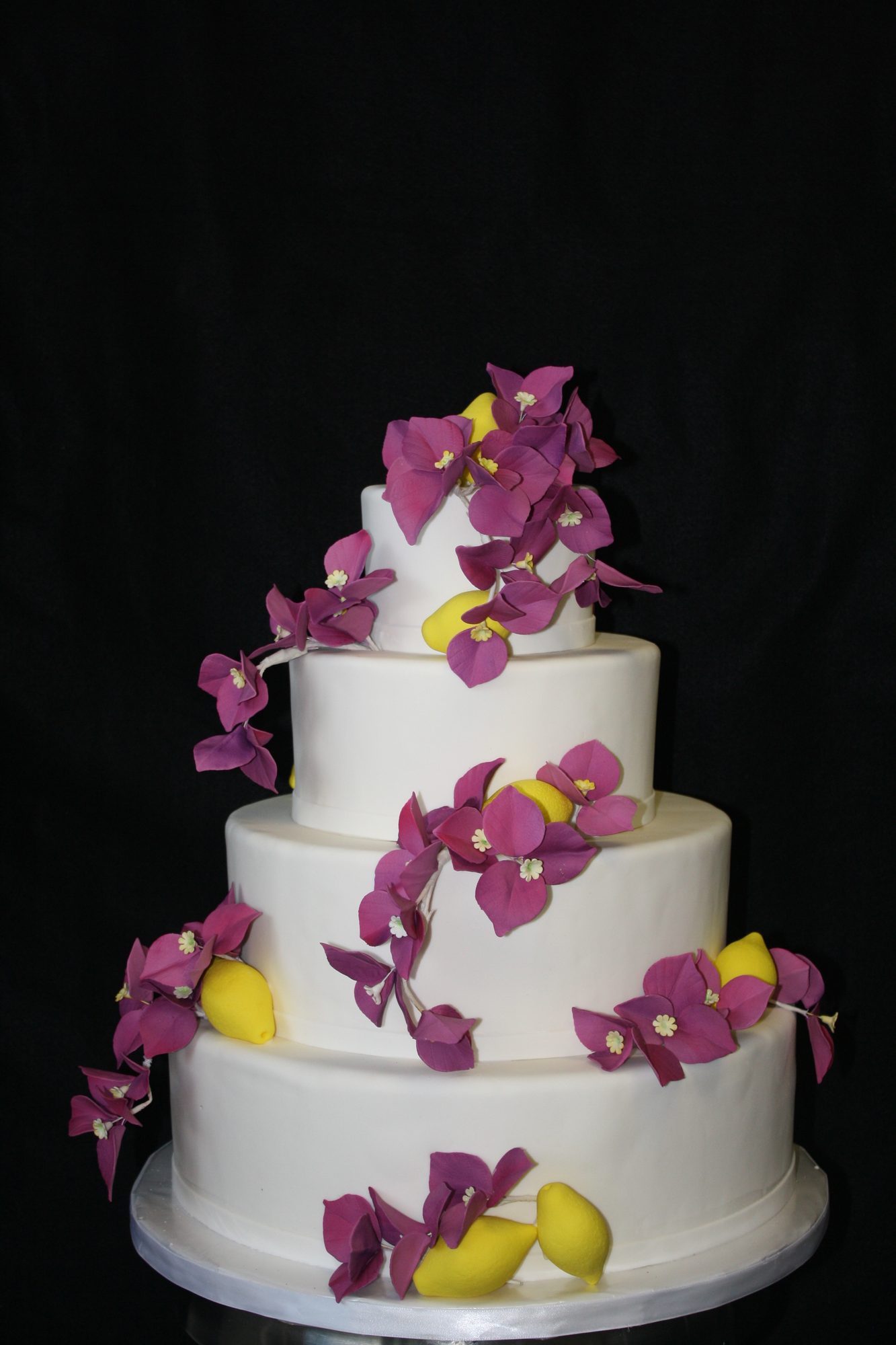 Wedding cake with sugar bougainvillea and lemons